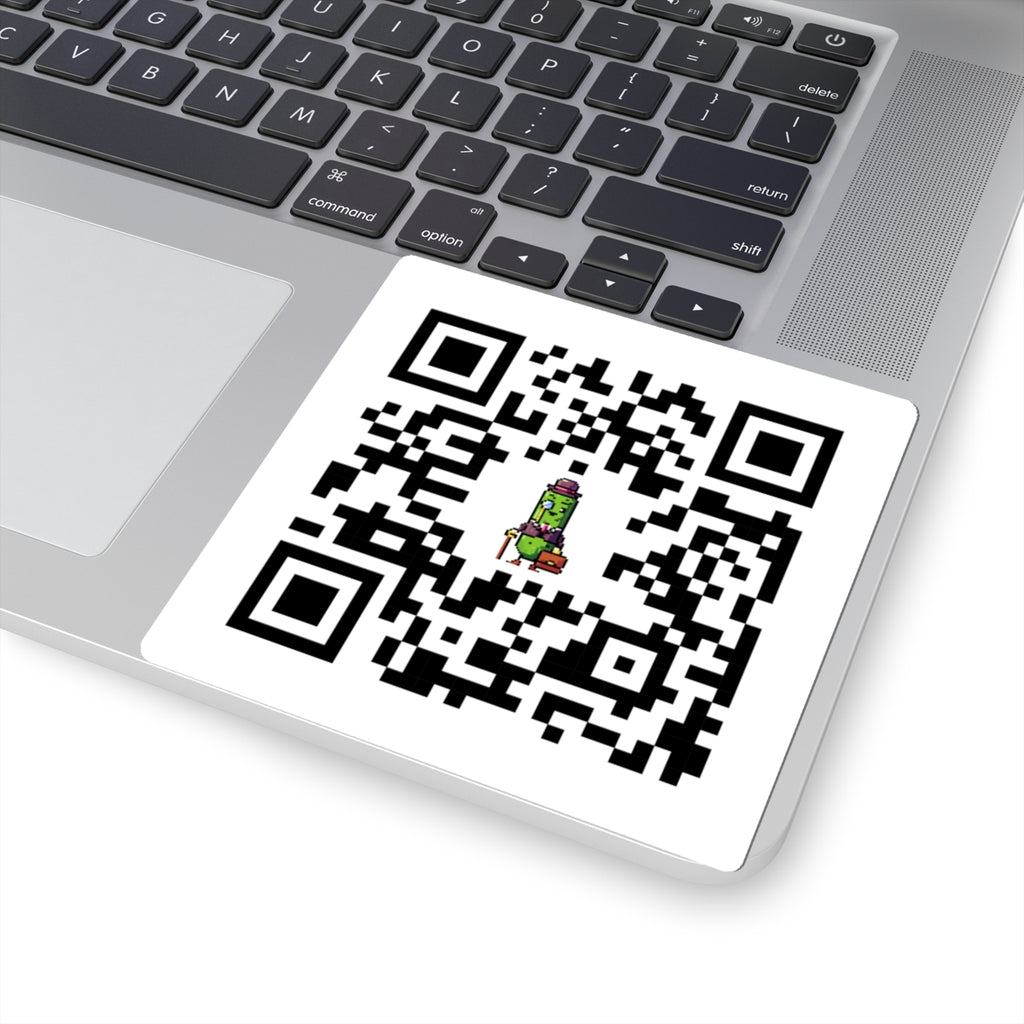 QR code on a laptop keyboard with a small graphic of a character below it